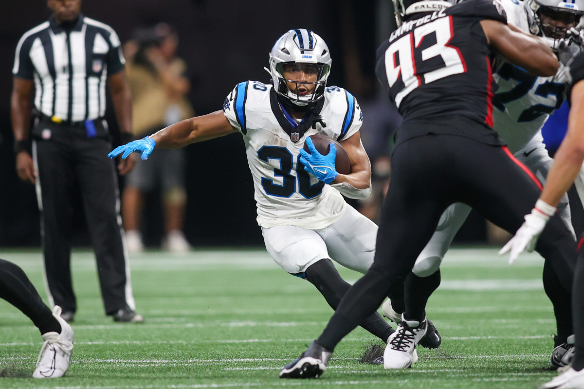 Sep 10, 2023; Atlanta, Georgia, USA; Carolina Panthers running back Chuba Hubbard (30) runs the ball against the Atlanta Falcons in the second half at Mercedes-Benz Stadium.